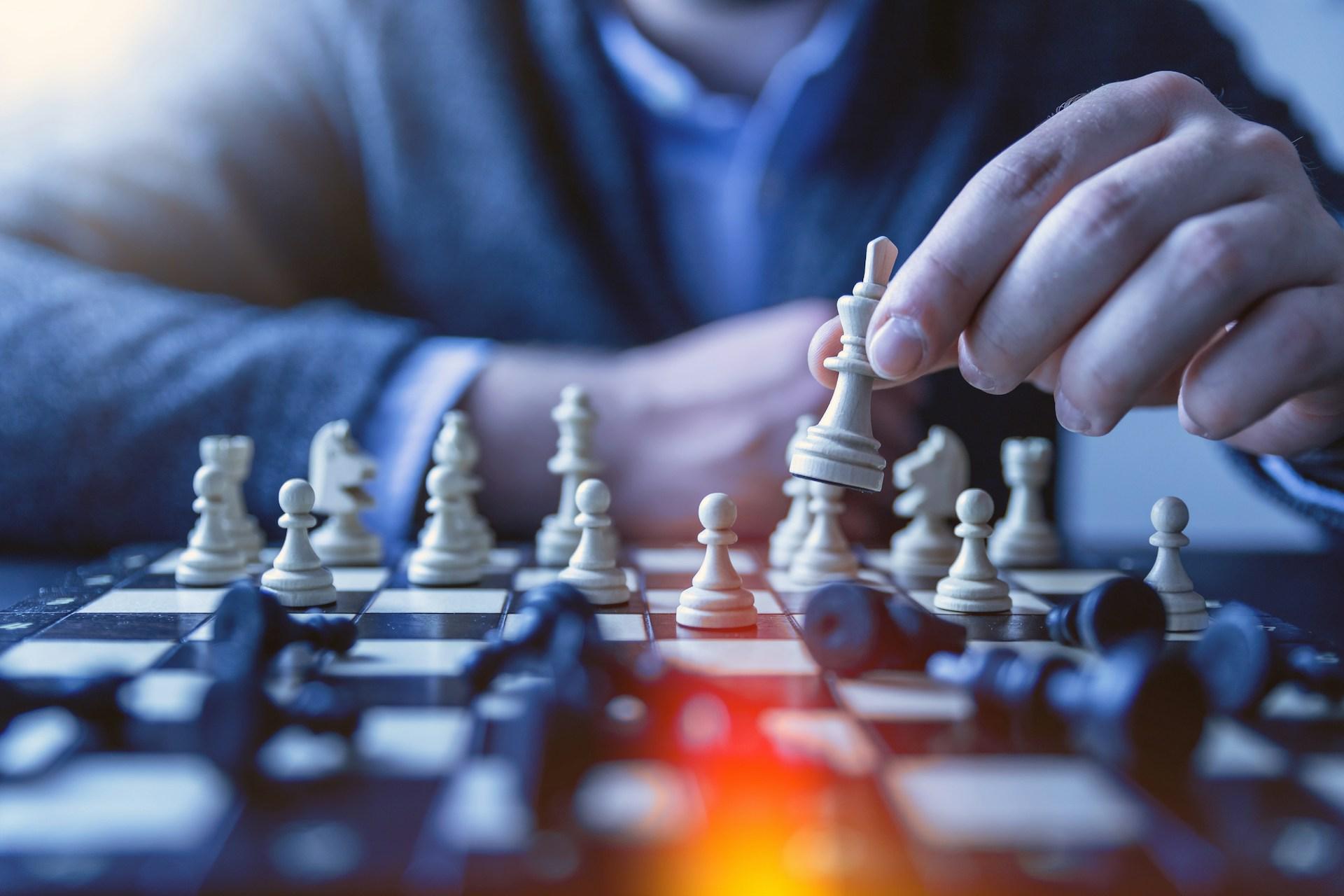 A businessman making a move in a chessboard